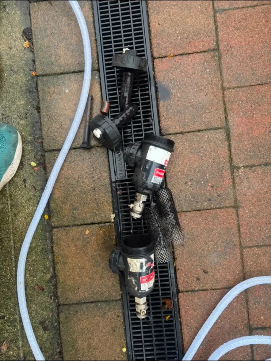 Magnetic system filters stripped down and cleaned during a heating system flush