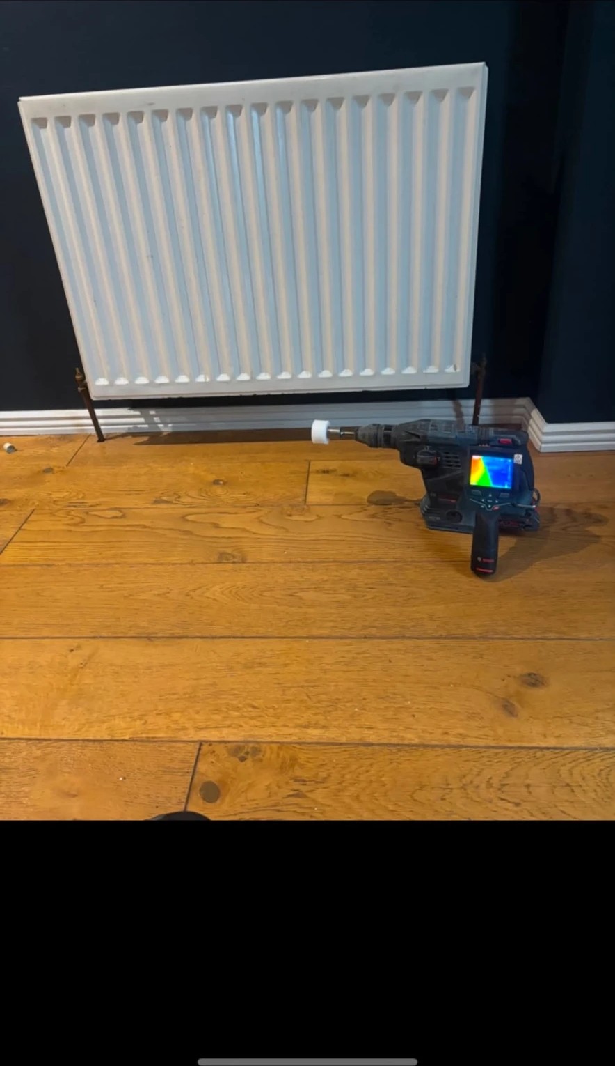 Radiator removed from the wall with a thermal imaging camera used to check heat distribution